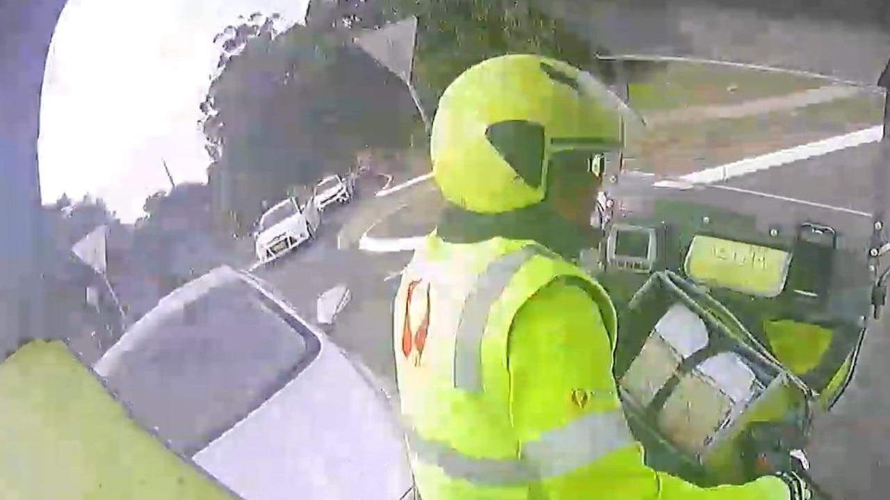 A still image of footage from a crash involving a sedan not giving way to a postie. Picture: Australia Post