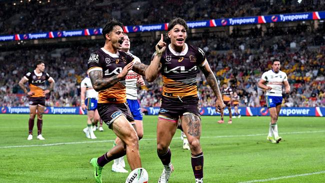 Reece Walsh does the viral ‘What’s up brother’ celebration after scoring for the Broncos. Picture: Getty Images