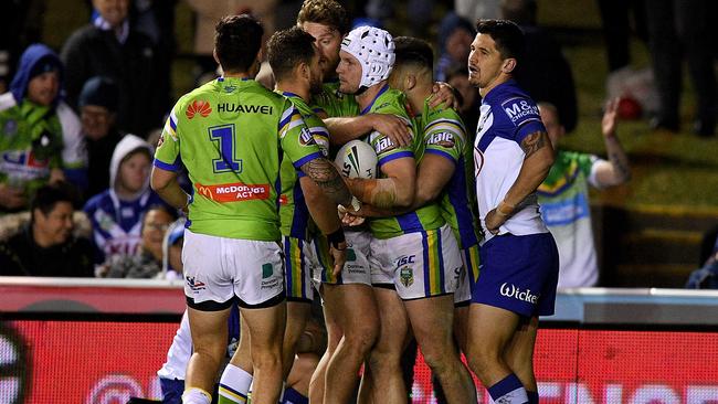 Jarrod Croker of the Raiders (centre) celebrates with teammates after scoring a try during the Round 17 NRL match between the Canterbury-Bankstown Bulldogs and the Canberra Raiders at Belmore Sports Ground in Sydney, Saturday, July 7, 2018. (AAP Image/Dan Himbrechts) NO ARCHIVING, EDITORIAL USE ONLY