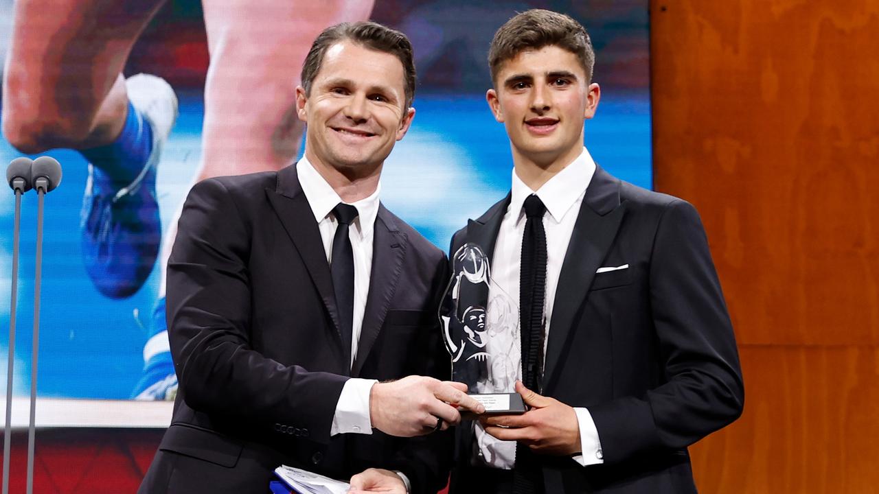 MELBOURNE, AUSTRALIA - AUGUST 30: Harry Sheezel of the Kangaroos is presented with the AFLPA Best First Year Player Award by Patrick Dangerfield of the Cats during the 2023 AFL Awards at Centrepiece on August 30, 2023 in Melbourne, Australia. (Photo by Dylan Burns/AFL Photos via Getty Images)