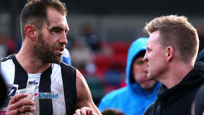 Travis Cloke talks to Nathan Buckley during a break in a VFL game.