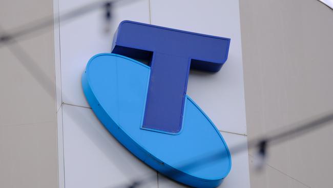 MELBOURNE, AUSTRALIA - NewsWire Photos OCTOBER 4, 2022. Generic photo people walking past the Telstra logo in Melbourne..Picture: NCA NewsWire / Luis Enrique Ascui