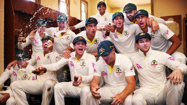 The Australian team celebrate their Ashes win in the SCG dressing room on Monday.