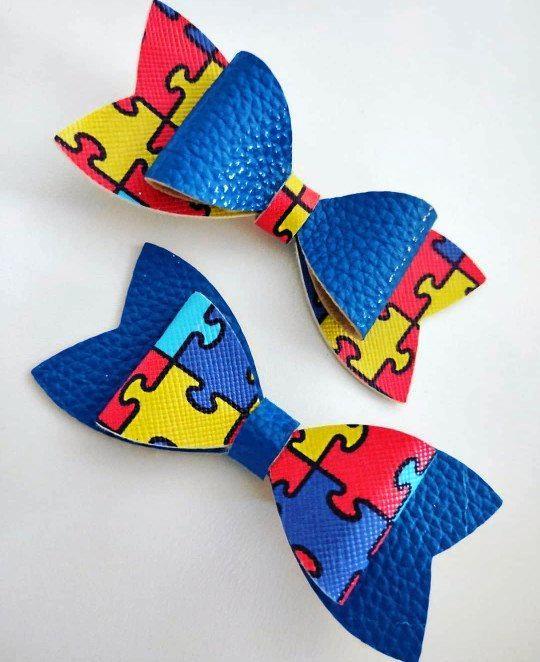 Raquel Strange through her So Bella Bow's has created an autism awareness bow for her son Aidan who is on the spectrum. Picture: Contributed