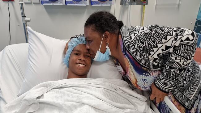 Xavier with his mother Romule before his surgery at St Vincent Private Hospital. Picture: St Vincent Private Hospital