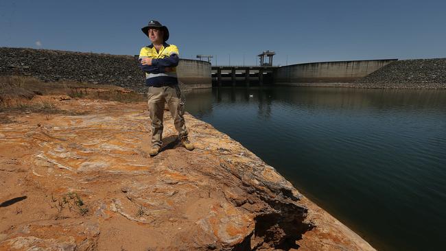 Wivenhoe senior dam operator Matthew O'Reilly last October, standing in an area that should be covered in metres of water. the recent deluge has added just 0.1 per cent to the dam’s capacity. Picture: Lyndon Mechielsen/The Australian