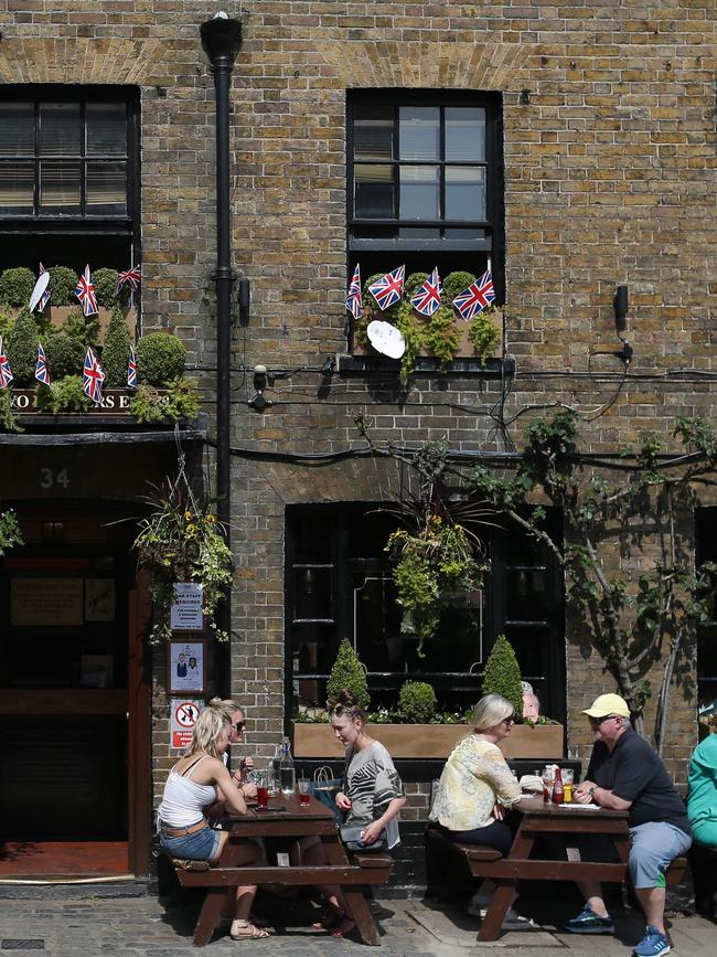 Pubs are preparing to host thousands of royal fans on the day and will be screening the wedding. Picture: AFP/Daniel Leal-Olivas