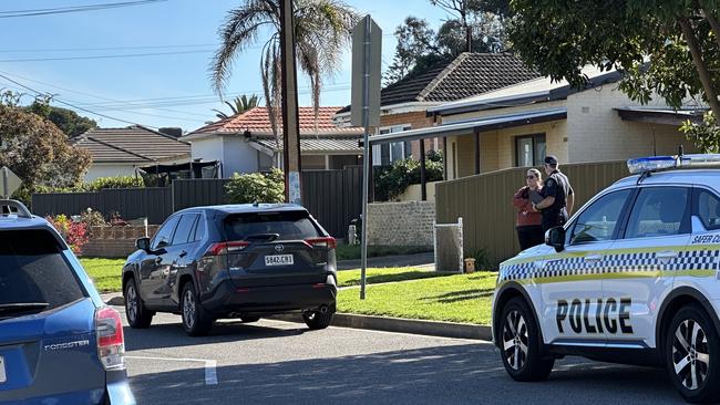 Police and locals outside on the street as the siege unfolded. Picture: Emily Jarvis,