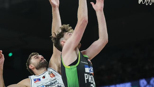 MELBOURNE, AUSTRALIA - FEBRUARY 16: Matt Hurt of the Phoenix drives to the basket under pressure during the NBL Play-In match between South East Melbourne Phoenix and Adelaide 36ers at John Cain Arena, on February 16, 2025, in Melbourne, Australia. (Photo by Daniel Pockett/Getty Images)