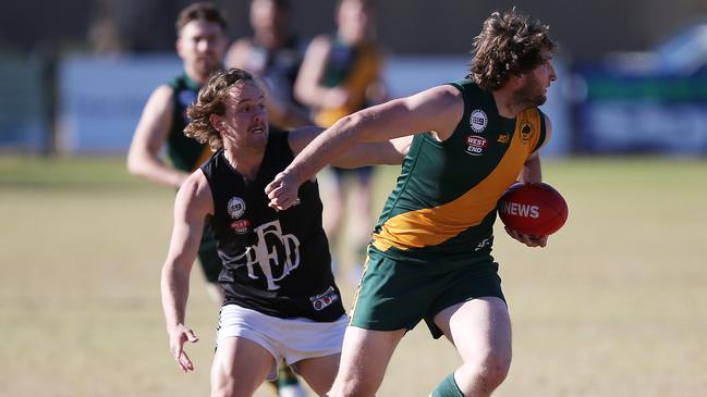 Salisbury North’s Steven Evans evades a tackler in 2017. Picture: AAP/James Elsby