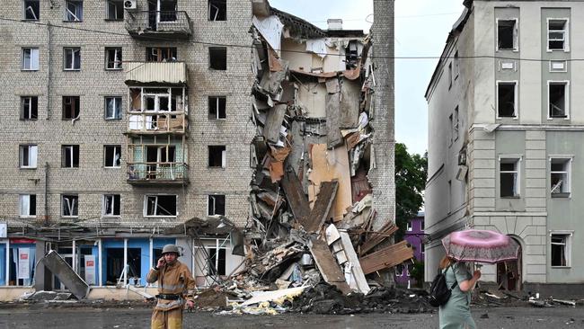 A building partially destroyed after a Russian missile strike in Kharkiv on Monday. Picture: AFP