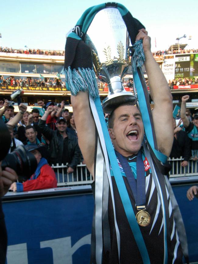 Power skipper Warren Tredrea with the 2004 premiership cup.