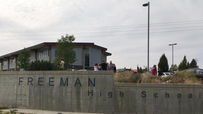 People gather outside of Freeman High School after reports of a shooting at the school in Washington state. Picture: AP