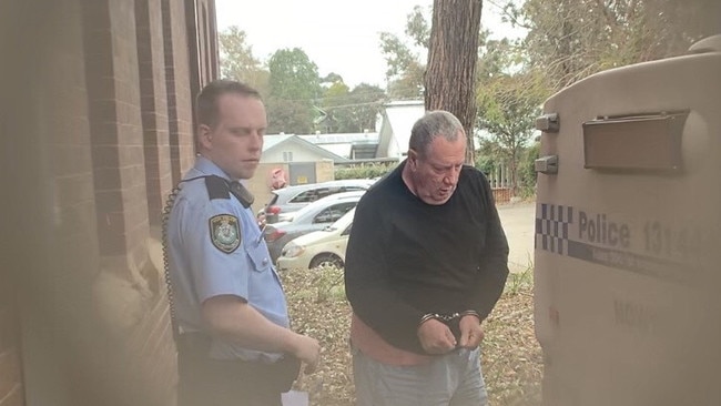 Stuart Mould being arrested last year.