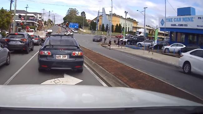 Screen grabs of eight teens running to a waiting car. Pic: Dash Cam Owners Australia Facebook