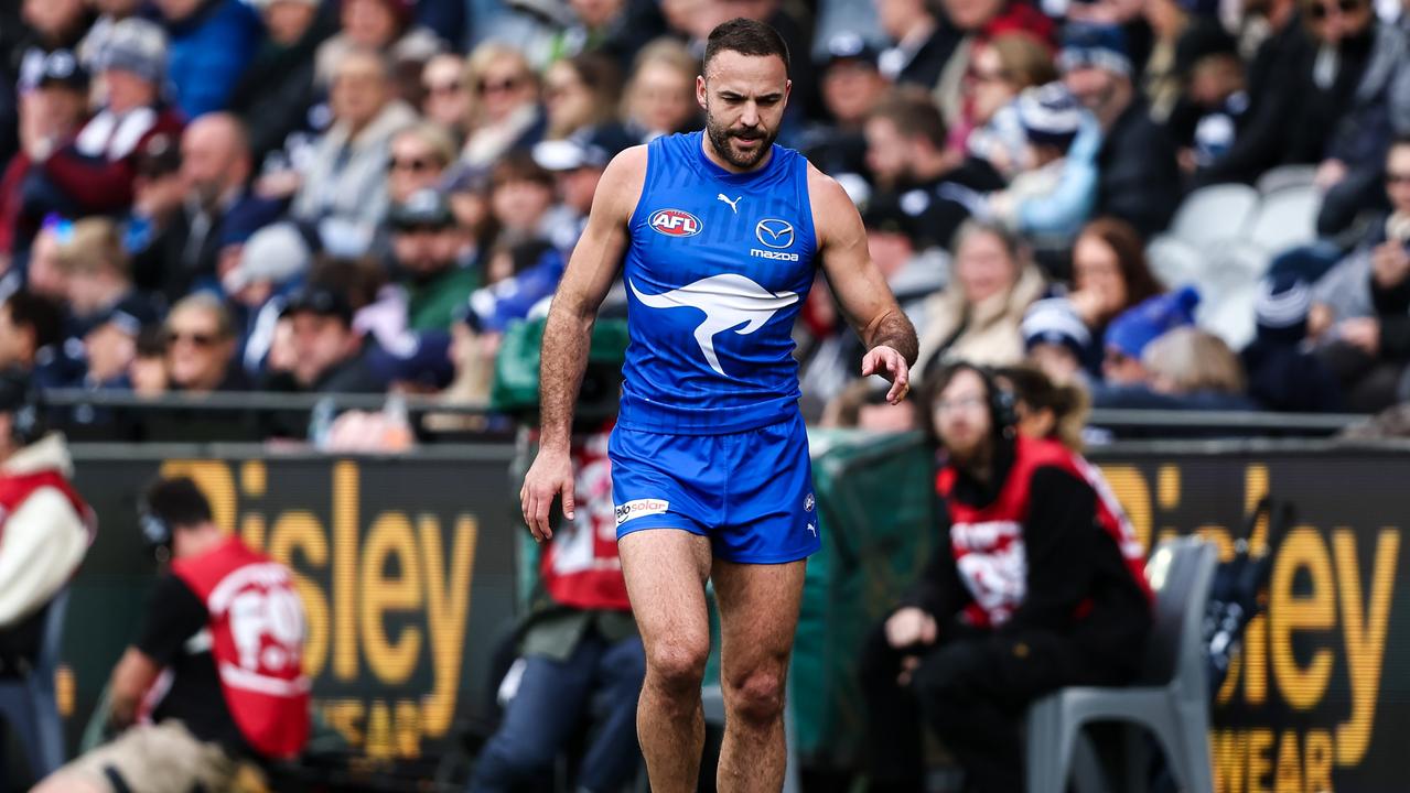 Griffin Logue leaves the field at Geelong (Photo by Dylan Burns/AFL Photos via Getty Images)