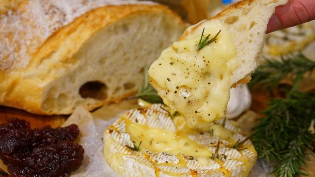 Enjoy some melted brie with baguettes at the French Christmas Market. Picture: Supplied