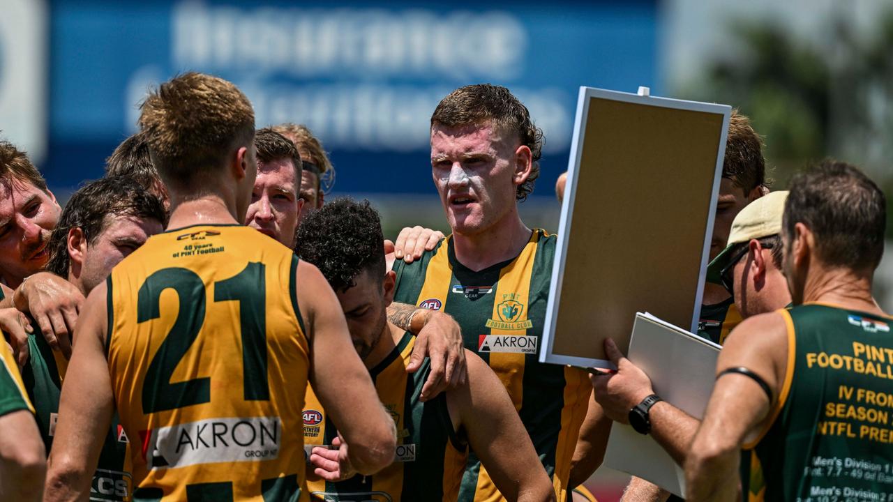 Players from PINT Football Club during an NTFL game.