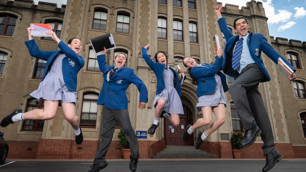 Loyola Watsonia year 12 students Lauren Trenou, Elijah Treglia, Callista Nguyen, Jayde Smith and Aidan Fenech celebrate their return to school. Picture: Tony Gough