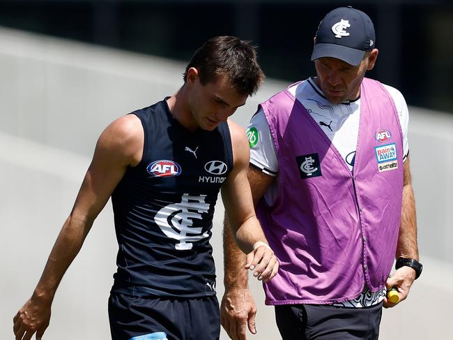 MELBOURNE, AUSTRALIA - FEBRUARY 22: Jagga Smith of the Blues limps from the field during the 2025 AFL match simulation between the Carlton Blues and St Kilda Saints at Ikon Park on February 22, 2025 in Melbourne, Australia. (Photo by Michael Willson/AFL Photos via Getty Images)