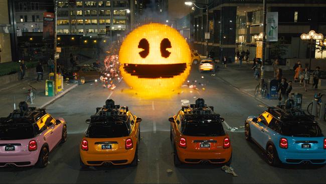 Inky, Blinky, Clyde and Pinky (the ‘ghost’ cars) take on Pac-Man in <i>Pixels</i>.