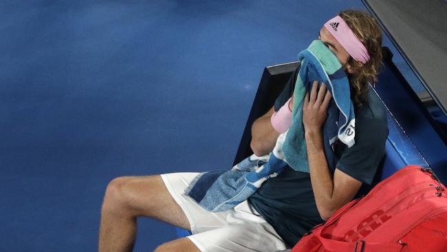 Greece's Stefanos Tsitsipas rests in his chair as his hopes disappear in the semi-final against Rafael Nadal. Picture: Kin Cheung/AP