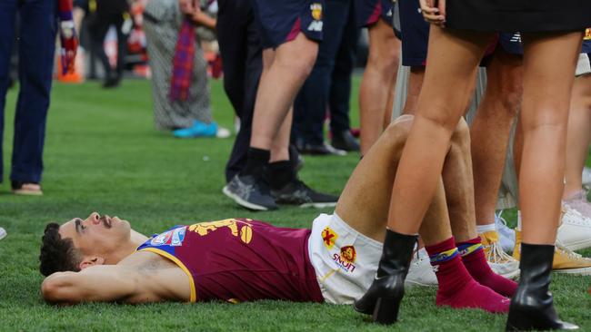 A shattered Cameron after the siren sounds at the 2023 AFL Grand Final where Collingwood defeated the Brisbane Lions by 4 points at the MCG. Picture Lachie Millard