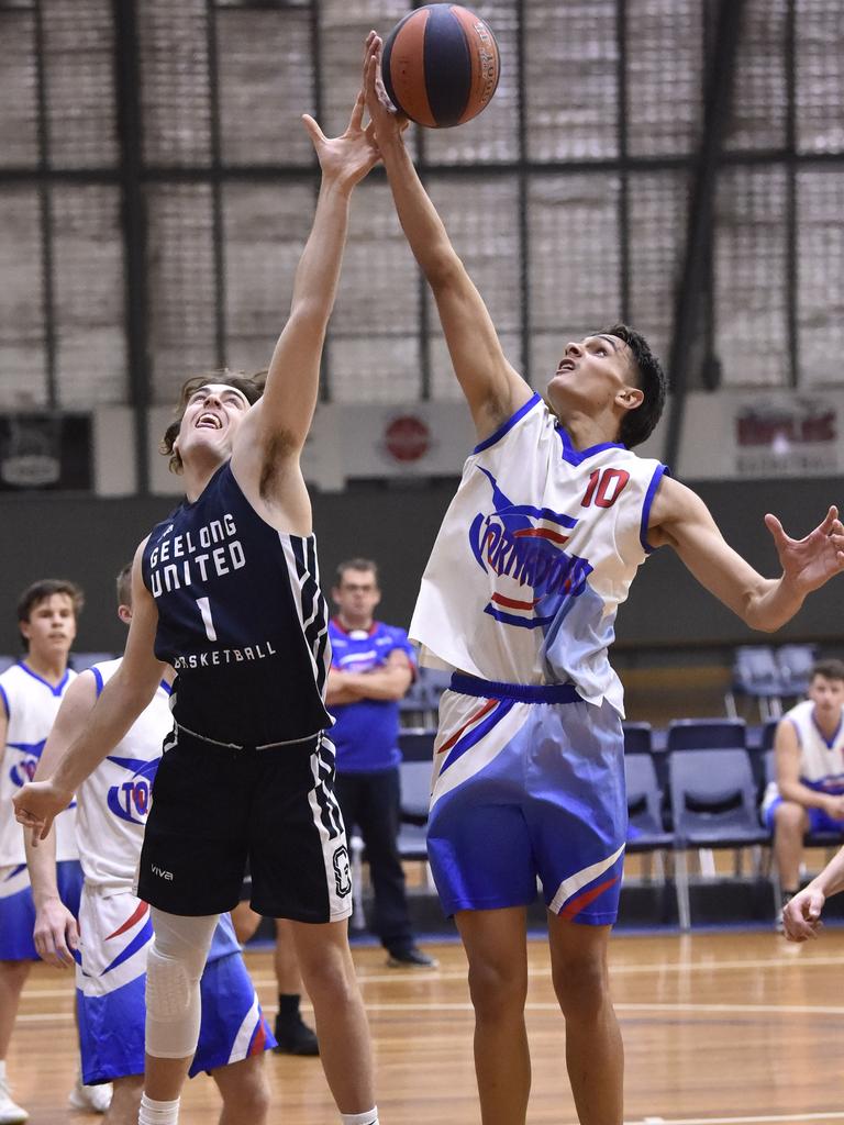 Jamarra Ugle-Hagan (right) leaps for the ball while playing for Terang in the Country Basketball League last summer. Picture: Alan Barber