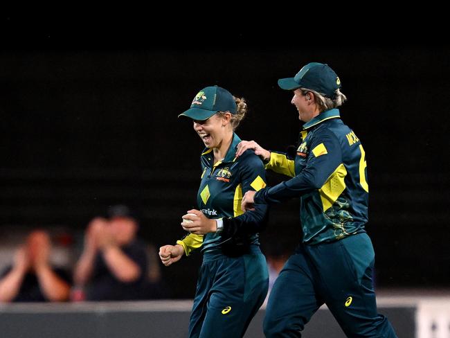 Aussie pair Phoebe Litchfield (left) and Beth Mooney celebrate the dismissal of West Indies star Hayley Matthews. Picture: Bradley Kanaris/Getty Images