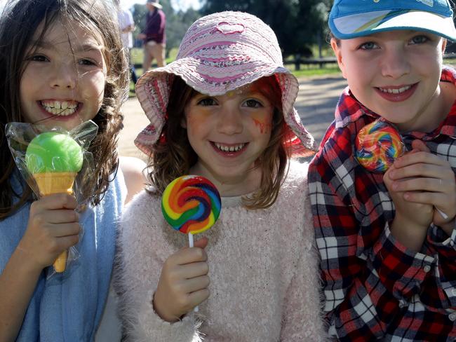 Emily (8), Rose (6) and Sophie (11) enjoying their treats.