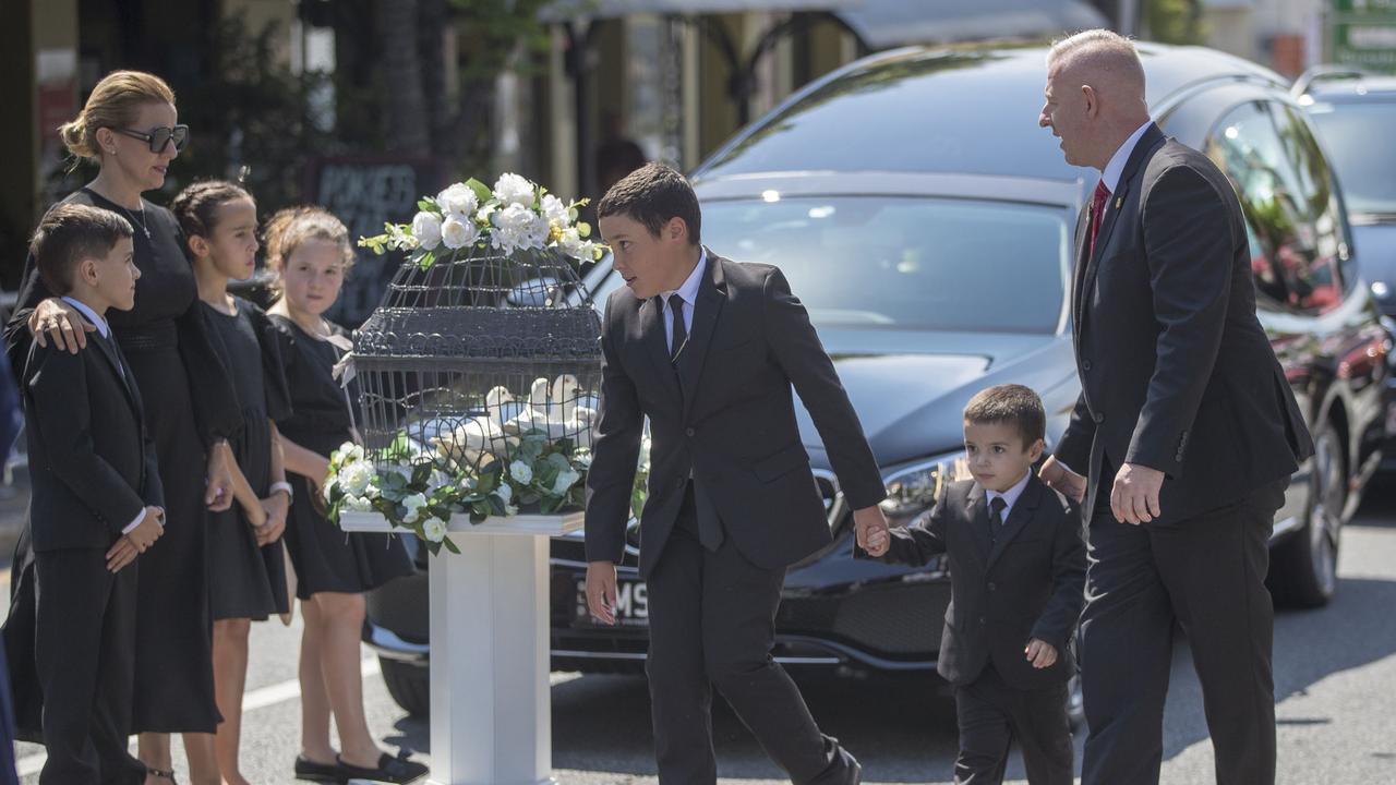 Mourners pay tribute to Michael Gambaro as his hearse passes Gambaro's in Caxton Street in 2020. Peter Wallis