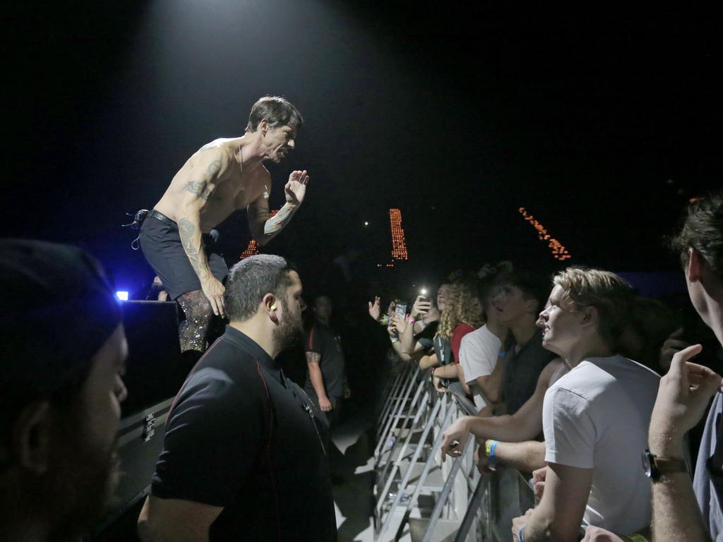 Red Hot Chili Peppers front man Anthony Kiedis asks audience members at Hobart's Derwent Entertainment Centre to spread a message through the crowd that the band is experiencing technical issues on stage. Picture: PATRICK GEE