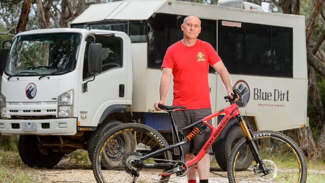 Brett Hollis runs a mountain biking business which can operate, but they just can't legally transport people up the hill to do it. Picture: Jay Town