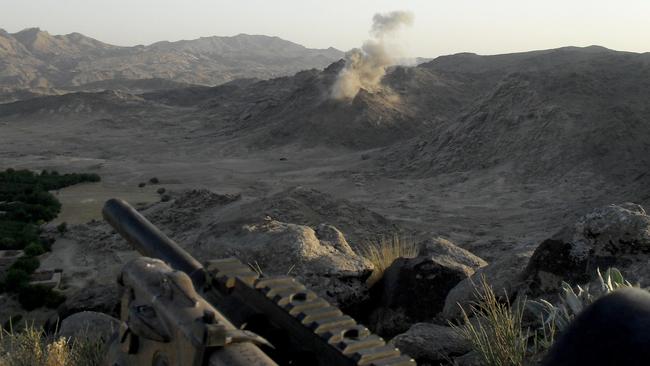 Australian troops watch a 500-pound bomb impact in Afghanistan.