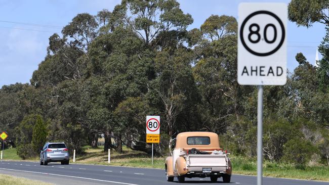 The new 80km road signs are seen along South Gippsland Highway in Cranbourne East. The new limit follows a fatal crash earlier in the year. Photo: James Ross