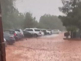 Sport cars were filmed behing shoved towards a cliff in raging floodwater. Picture: TikTok/getagripgarage