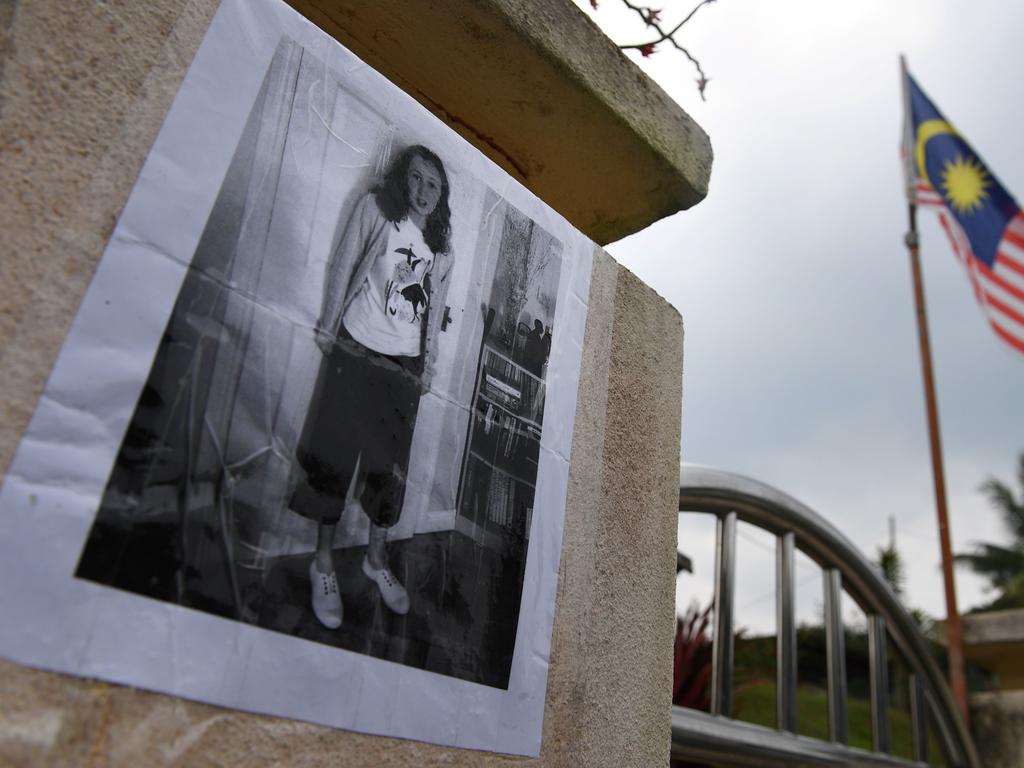 A poster showing missing 15-year-old Franco-Irish teenager Nora Quoirin is displayed outside a school. Picture: AFP)
