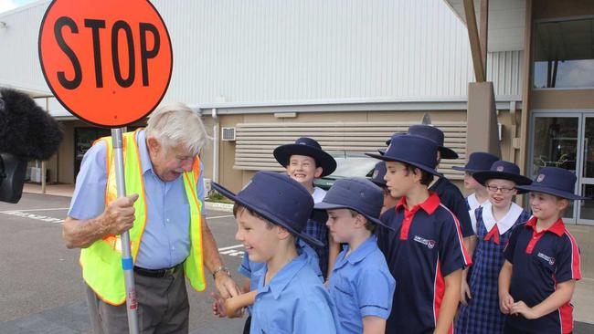 FAREWELL: Ted Pretty shaking hands with the last children he will ever help to cross the road at Sunshine Coast Christian College. Photo Kiera Kelly-Williamson / Caloundra Weekly. Picture: Kiera Kelly-Williamson