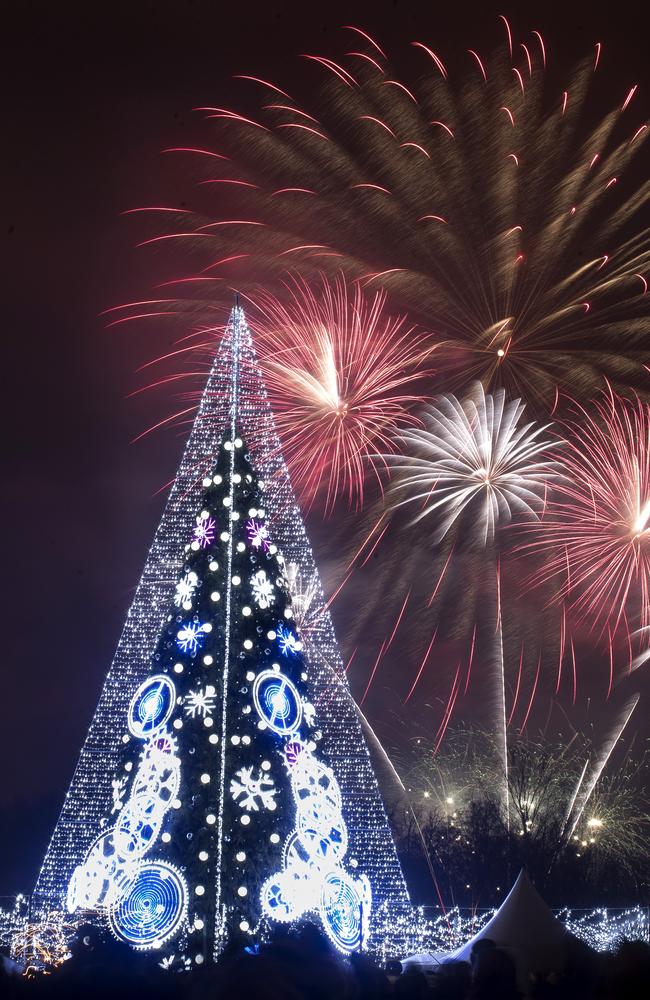 Fireworks light the sky above an illuminated Christmas tree at the Cathedral Square in Vilnius, Lithuania, shortly after midnight during the New Year's celebrations. Picture: AP