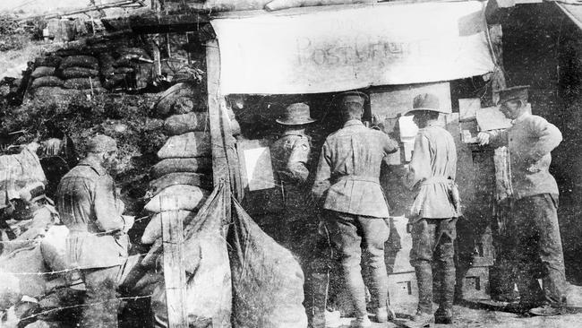 Soldiers queue to send and receive mail at a field post office in Gallipoli, 1915. Picture: Australian War Memorial