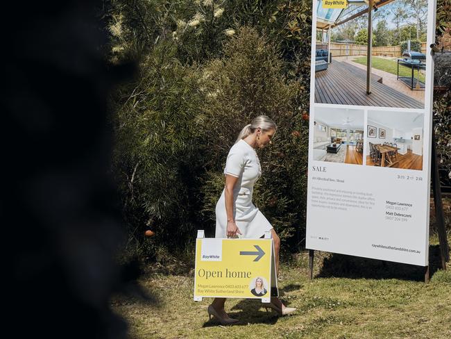 Interested buyers being served pizza at pizza party at open home nsw real estate