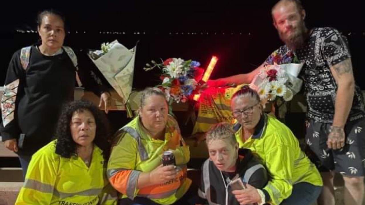 Workmates of Brendan Moreland pay tribute to the popular traffic controller at the site where he died. Back: Mirikia Ahmat and Matthew Wellington. Front: Sharon Ahmat, Deliah Serruerier, Nezzy Falzon and Robyn 'Robbi' Mapley.