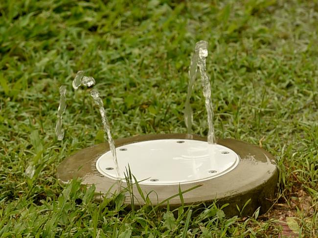 A fountain of sewage in a Wulguru property’s backyard during a rainfall event. Picture: Evan Morgan