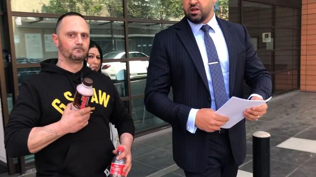 Mansour Mansour, 41, of Stanhope Gardens, leaves Blacktown Local Court with his partner and solicitor on September 26.