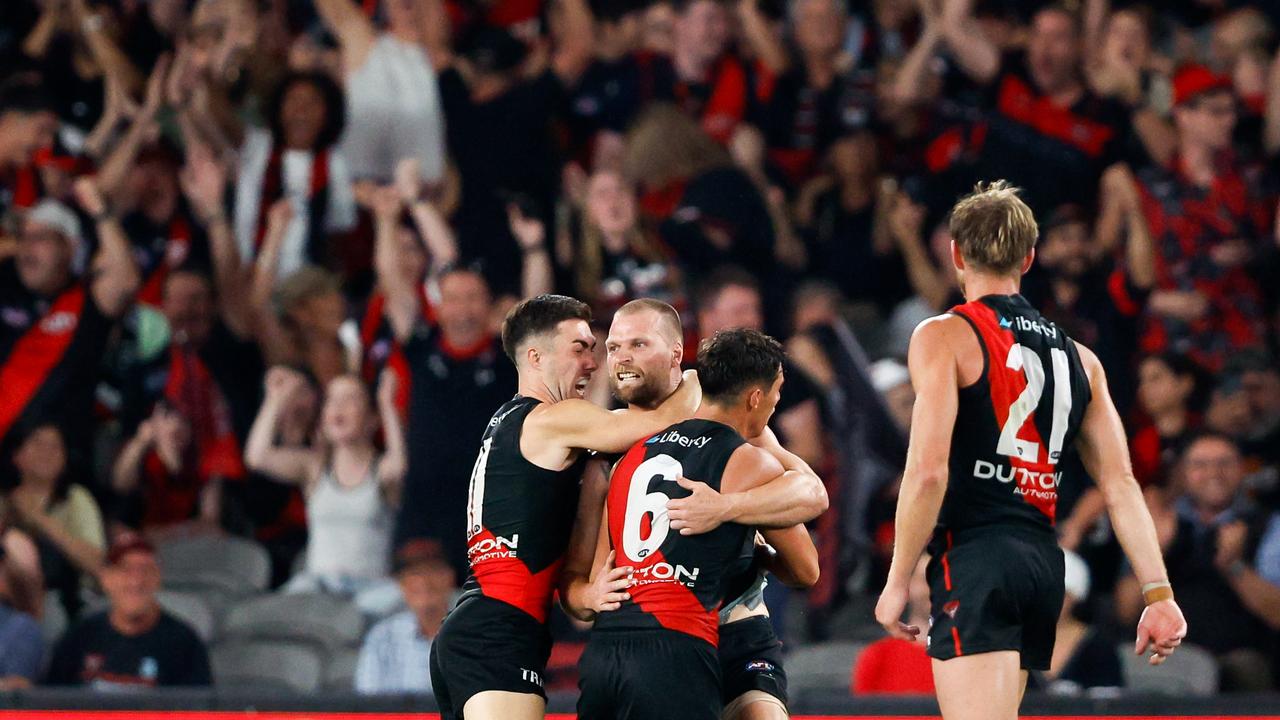 MELBOURNE, AUSTRALIA - MARCH 30: Jake Stringer of the Bombers celebrates a goal with teammates during the 2024 AFL Round 03 match between the Essendon Bombers and the St Kilda Saints at Marvel Stadium on March 30, 2024 in Melbourne, Australia. (Photo by Dylan Burns/AFL Photos via Getty Images)