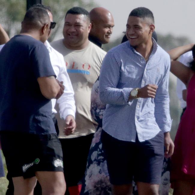 NRL player Manase Fainu pictured greeting family and friends after getting bail from Parklea Correctional Centre in 2019.