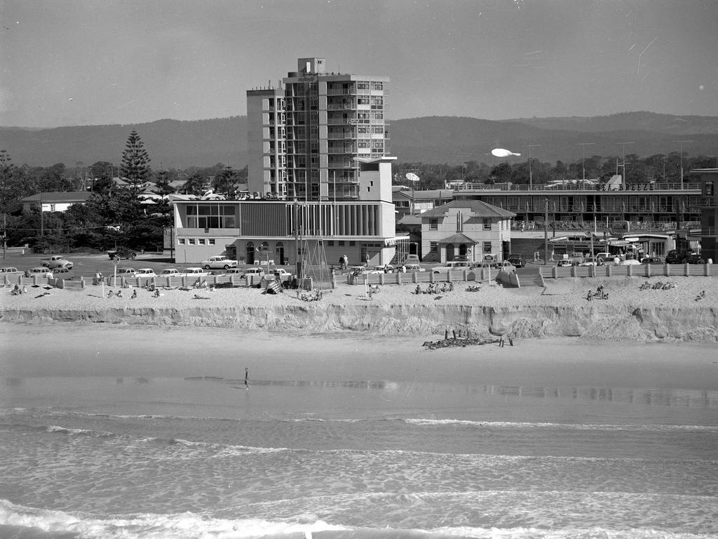 The new look at Surfers Paradise beach. High tide 7/6/60 left a steep cliff 10 feet high approximately 20 feet from the Esplanade after eroding thousands of tons of sand. In the centre of the picture is the new multistorey Kinkabool apartment building. Pic Eric Donnelly.