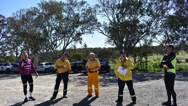 Abbott (far left) and Taylor (far right) donating to the RFS on the pollie pedal.