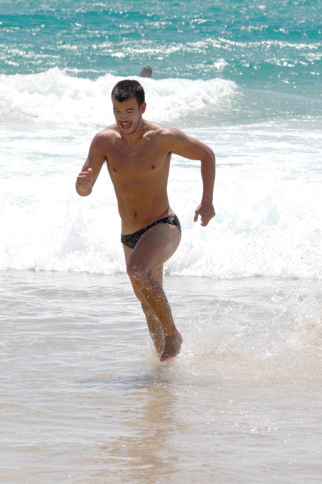 Tom Fields running out of the water during the Southport Sharks VFL team’s preseason training camp at Tallebudgera Beach. Picture: Mike Batterham