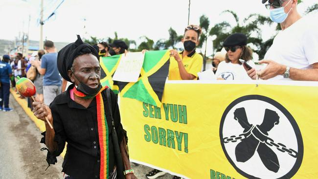 People calling for slavery reparations outside the entrance of the British High Commission during the visit of the Duke and Duchess of Cambridge in Kingston, Jamaica. Picture: Ricardo Makyn/AFP